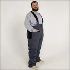 Man in gray Snow Country insulated ski snow bibs with suspenders for big and tall sizes