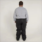 Man wearing gray shirt and black pants in Snow Country Insulated Ski Snow Pants