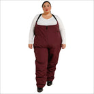 Woman wearing burgundy Snow Country Outerwear plus size winter snow ski bibs