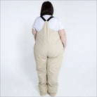 Beige plus-size snow bib overalls from Snow Country Outerwear Women’s Vertex collection