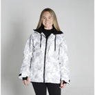 Woman wearing a white camouflage jacket from Snow Country Outerwear for snowboarding and winter skiing