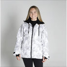 Woman wearing a white camouflage jacket from Snow Country Outerwear for snowboarding and winter skiing