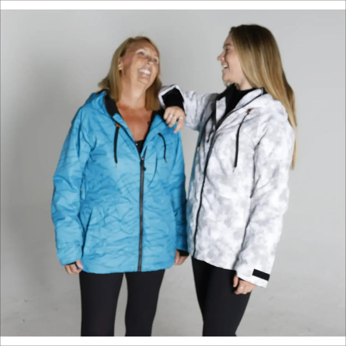 Two women wearing hooded jackets from Snow Country Outerwear Womens S-XL Trust Snowboarding Winter Ski Coat Jacket CLEARANCE