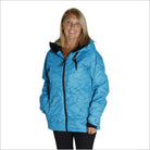 Woman in a blue hooded jacket wearing Snow Country Outerwear Ski Coat during winter