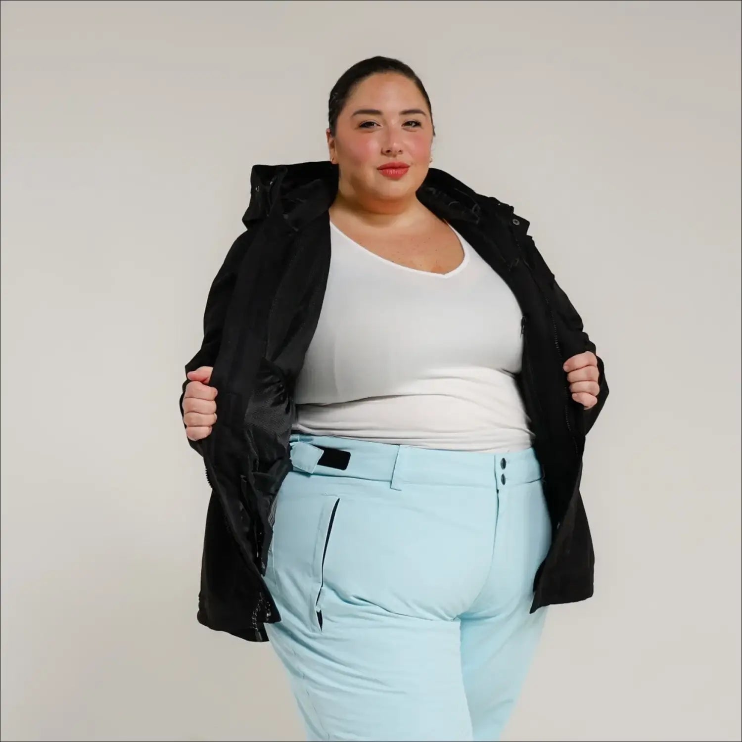 Woman in ski apparel wearing Snow Country Plus Size Uptown Winter Parka Ski Coat