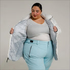 Woman in ski attire wearing Snow Country Outerwear Women’s Plus Size Puffy Winter Jacket