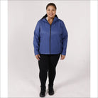 Woman in blue hooded plus size fleece soft shell jacket with black leggings and boots