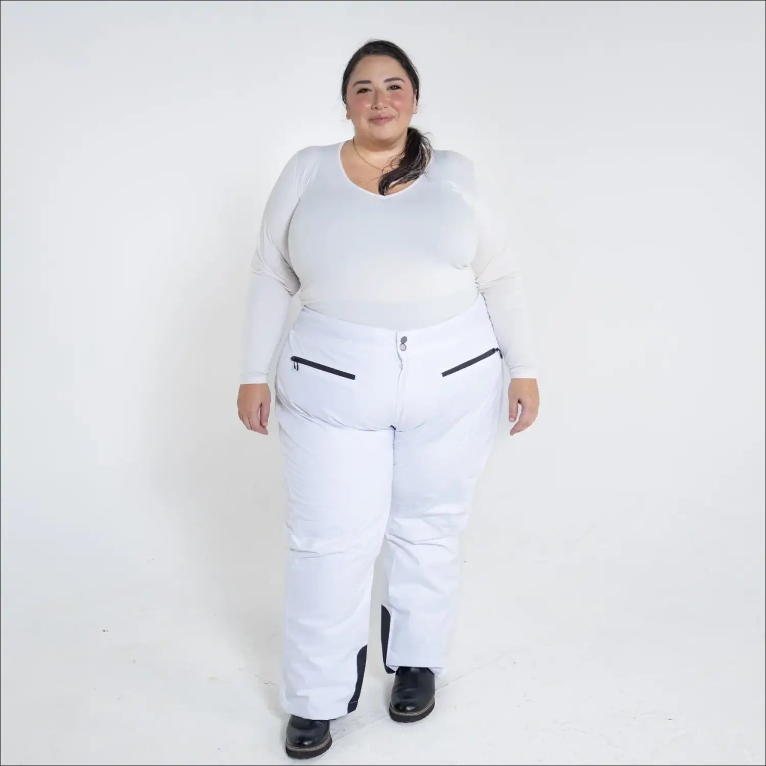 White women’s plus size insulated ski pants for winter snow mountain skiing activities