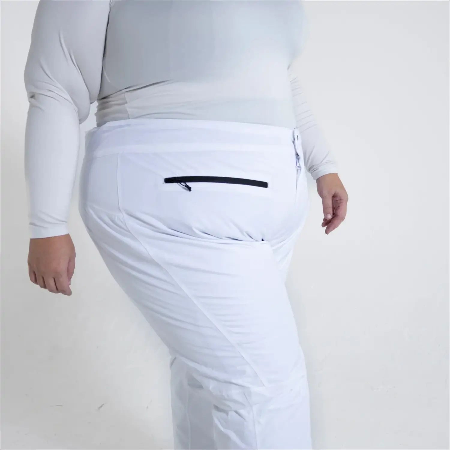 White ski pants with zippered pocket from Women’s Plus Size Trax Winter Ski Outerwear