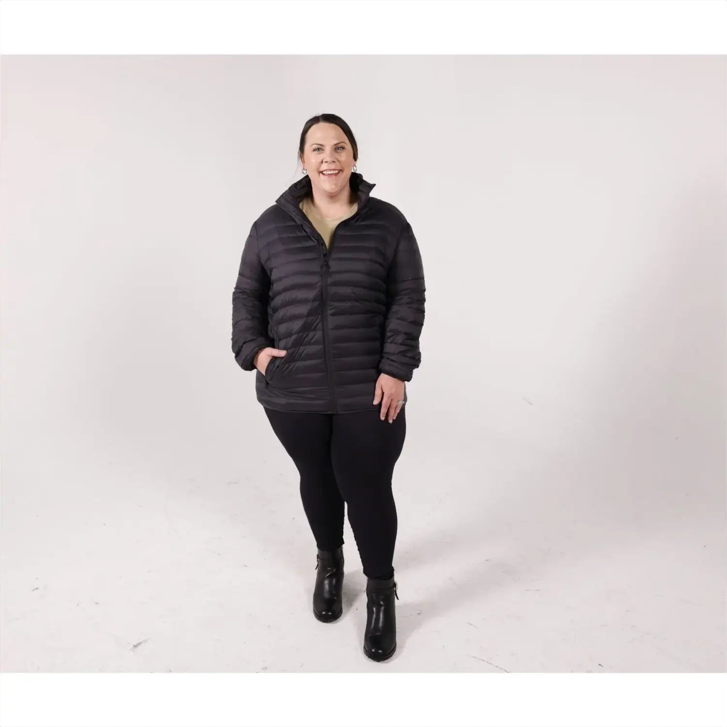 Woman in black puffer jacket wearing Sportcaster Women’s Plus Size Packable Down Jacket