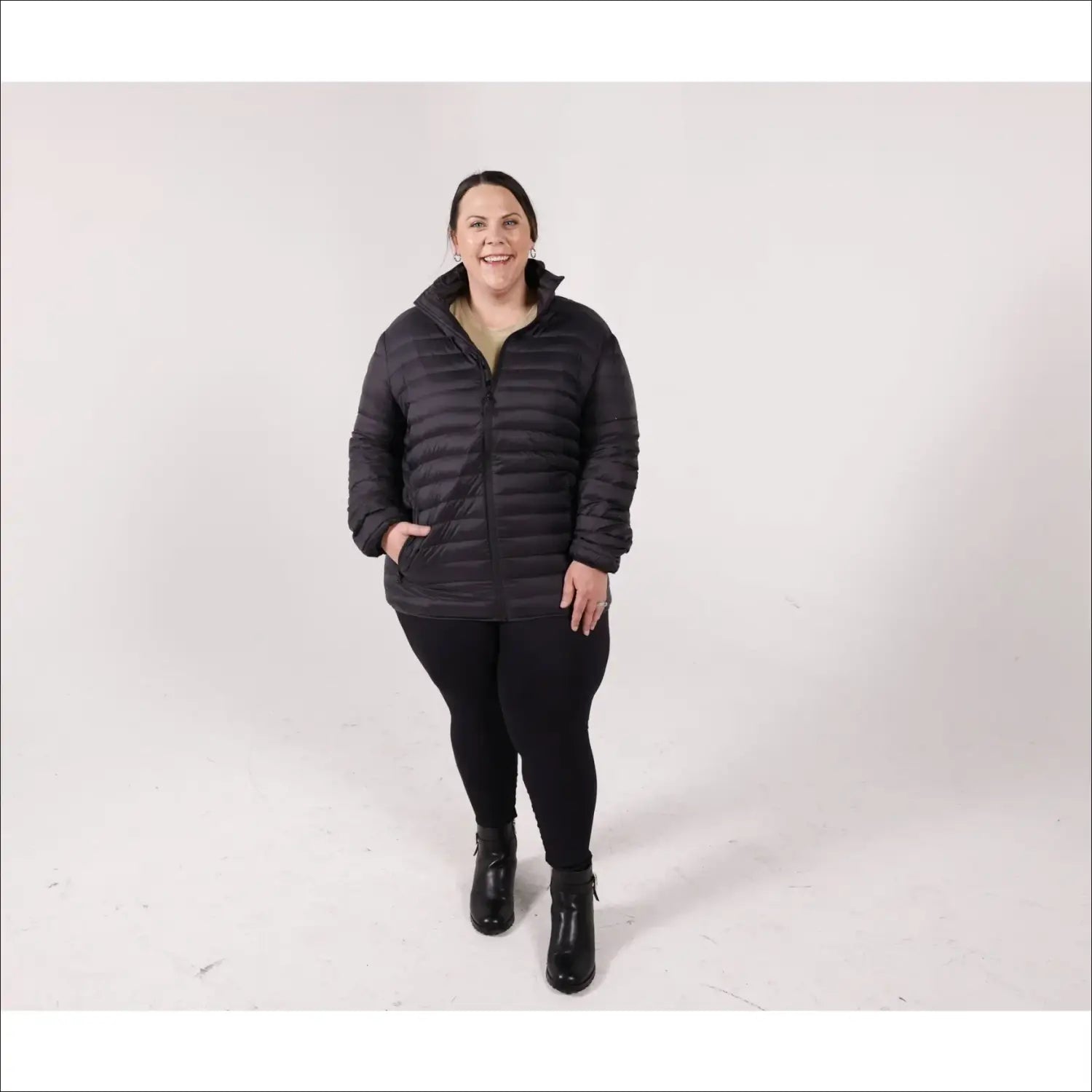 Woman in black puffer jacket wearing Sportcaster Women’s Plus Size Packable Down Jacket