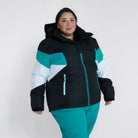 Woman wearing a color-blocked Snow Country Plus Size Ski Jacket and Pants for winter warmth