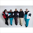 Plus-size women in colorful Snow Country winter jackets and pants for skiing or snow activities