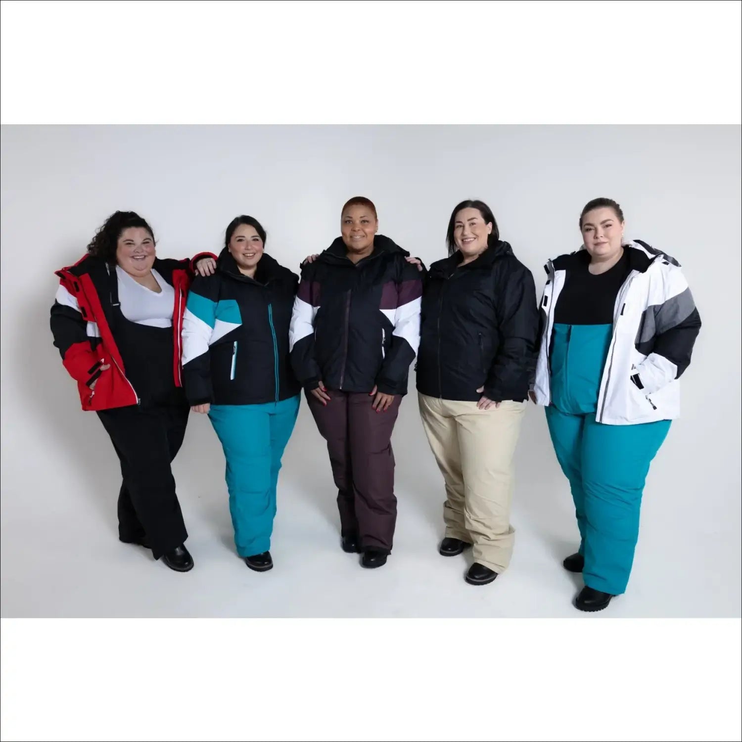 Plus-size women in colorful Snow Country winter jackets and pants for skiing or snow activities