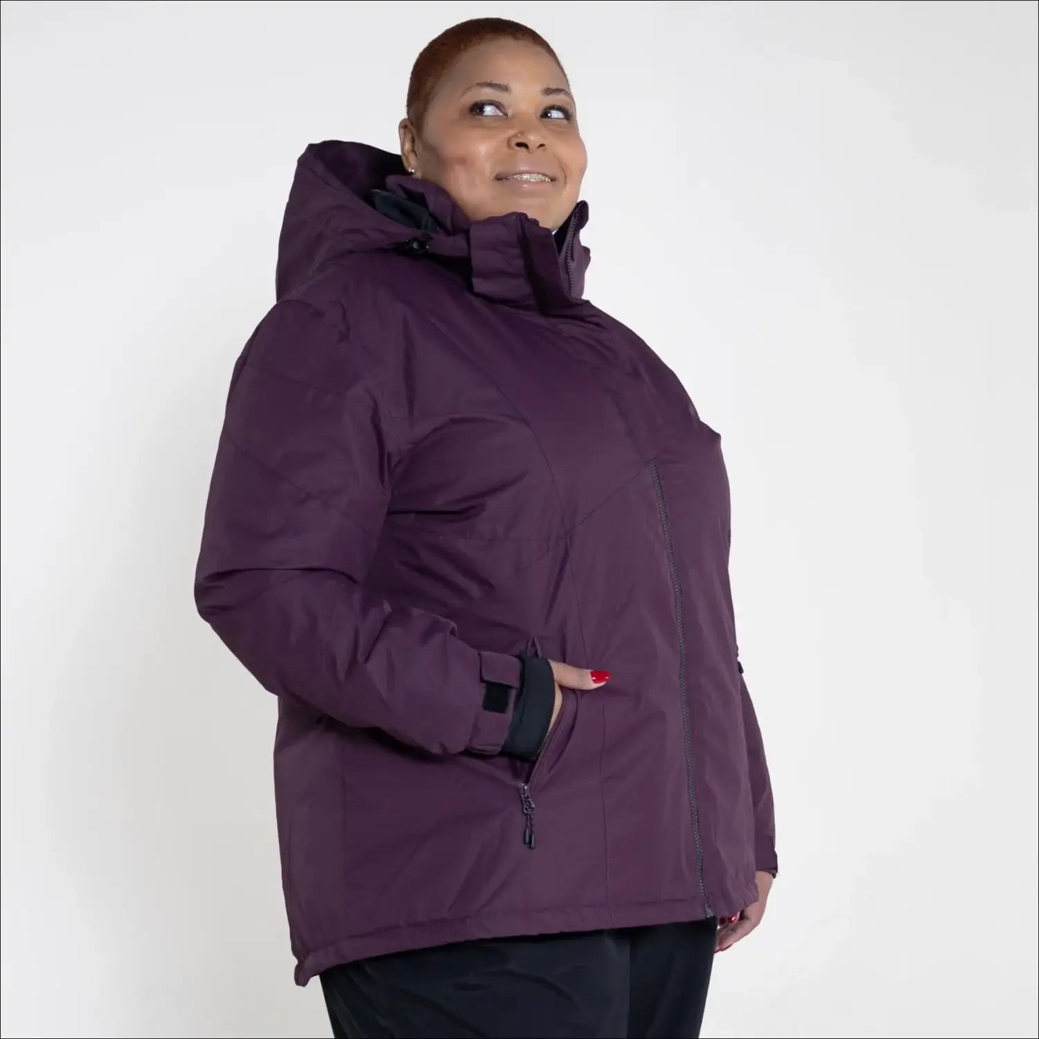 Plum-colored hooded winter jacket from Snow Country Outerwear Women’s Plus Size Ski Coat
