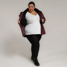 Burgundy jacket with black leggings and boots from Snow Country Outerwear Plus Size Ski Coat