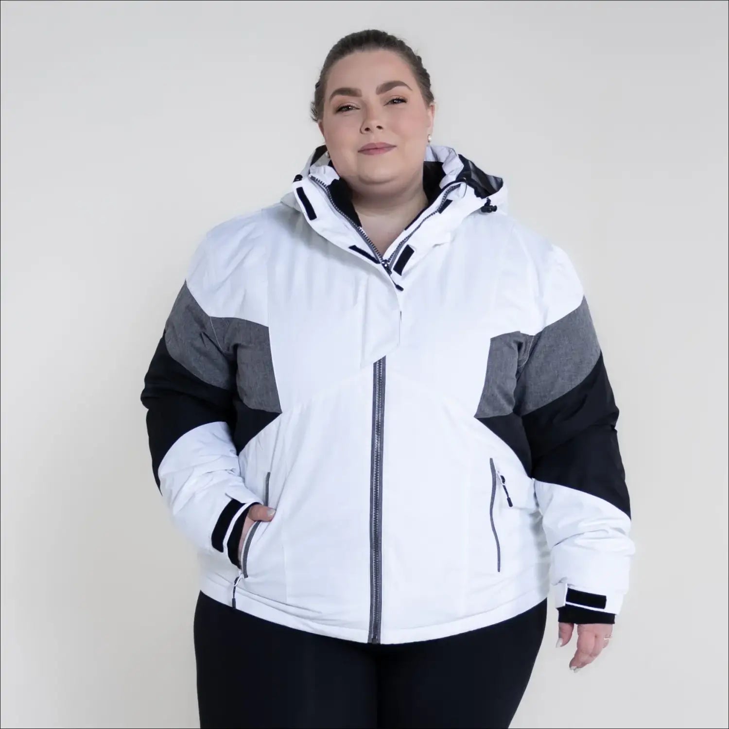 White, gray, and black hooded winter jacket from Snow Country Outerwear Plus Size Ski Coat