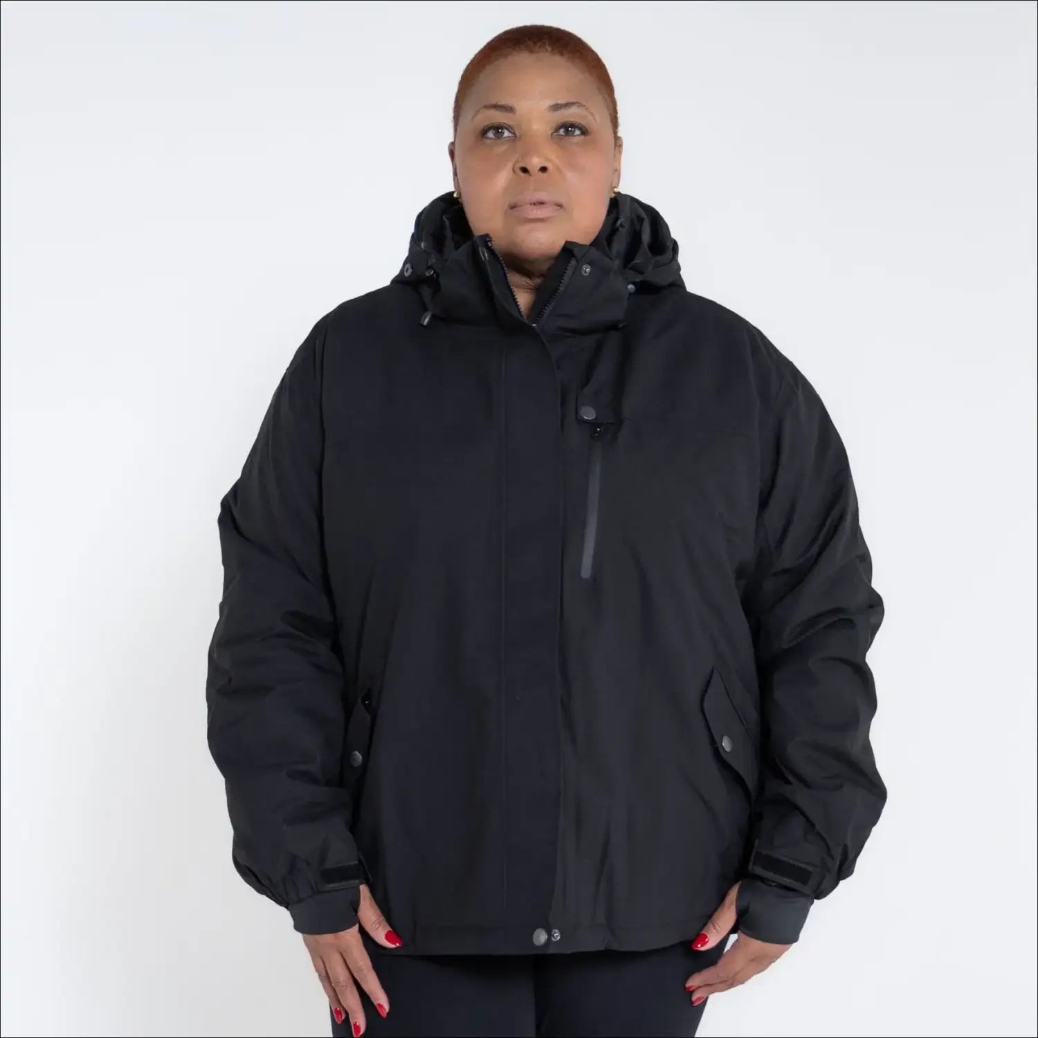 Black hooded puffer jacket from Snow Country Outerwear women’s plus size Fortress winter ski coat