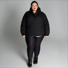 Woman wearing black puffer jacket from Snow Country Outerwear Fortress Winter Snow Ski Coat