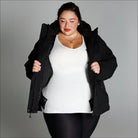 Woman in black puffer jacket from Snow Country Outerwear Plus Size Fortress winter coat