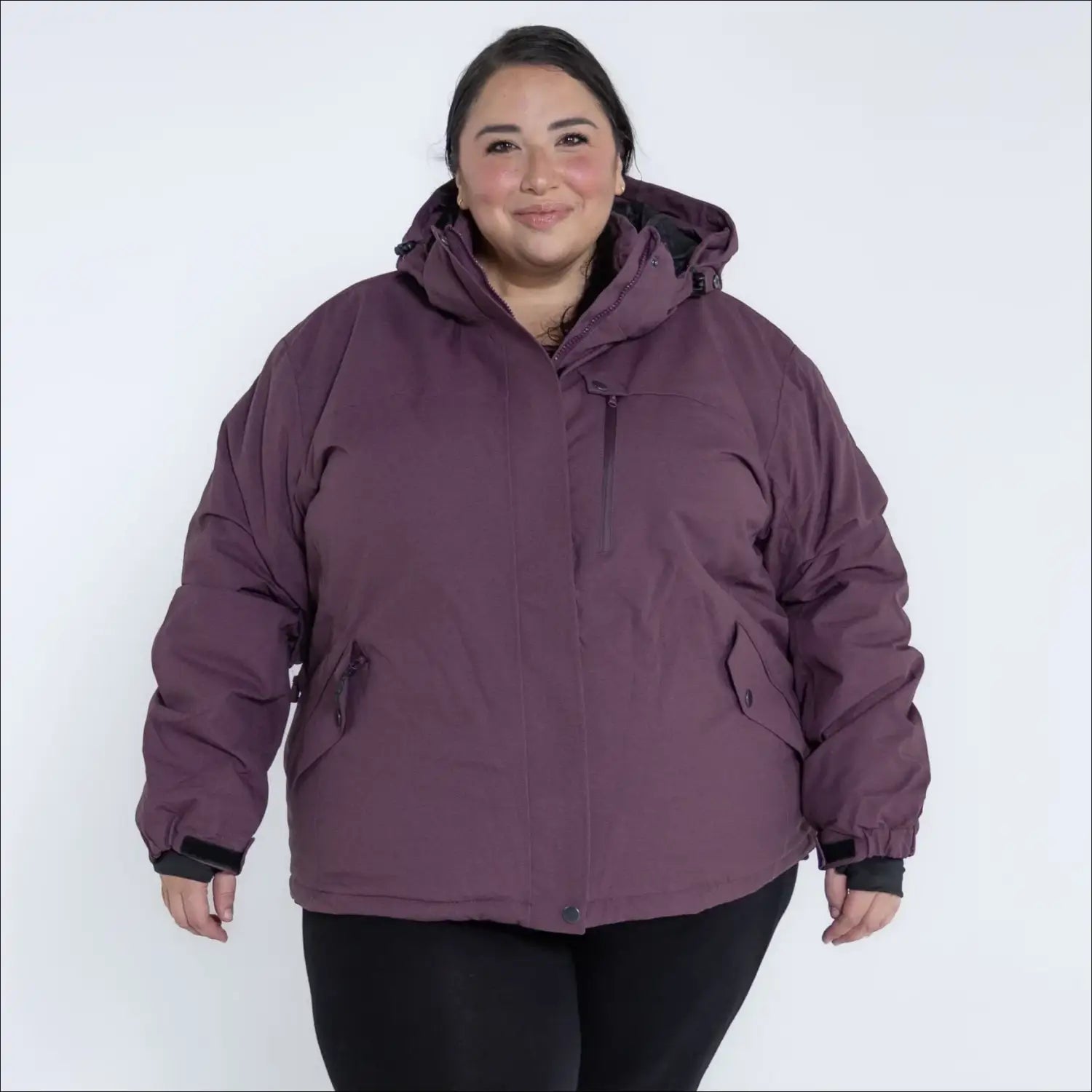 Plum-colored hooded puffer jacket from Snow Country Outerwear Women’s Plus Size Fortress Winter Snow Ski Coat