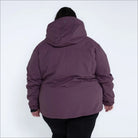 Plum-colored winter coat with hood from Snow Country Outerwear Women’s Plus Size Fortress collection