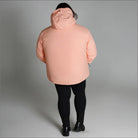 Peach-colored hooded puffer jacket from Snow Country Outerwear Women’s Plus Size Fortress collection