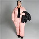 Woman in pink quilted ski suit wearing Women’s Plus Size 1X-6X winter coat outerwear
