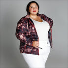 Woman wearing floral puffer jacket from Women’s Plus Size 1X-6X Winter Down Alternative Coat