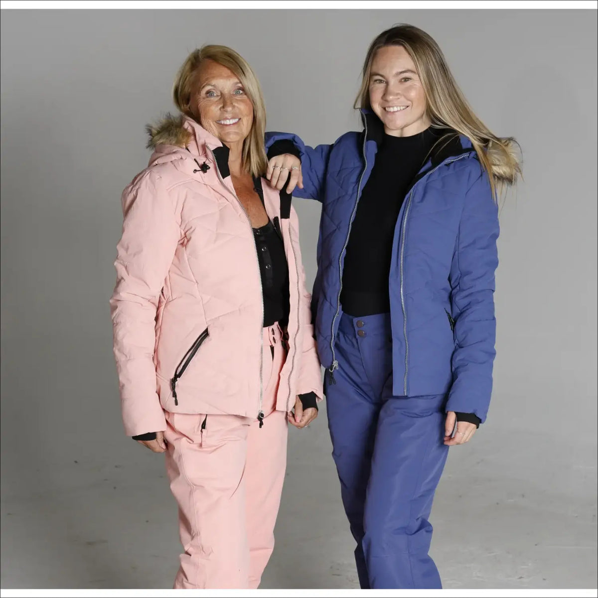 Two women wearing Snow Country Outerwear Womens Vail Down Alternative Winter Ski Jackets
