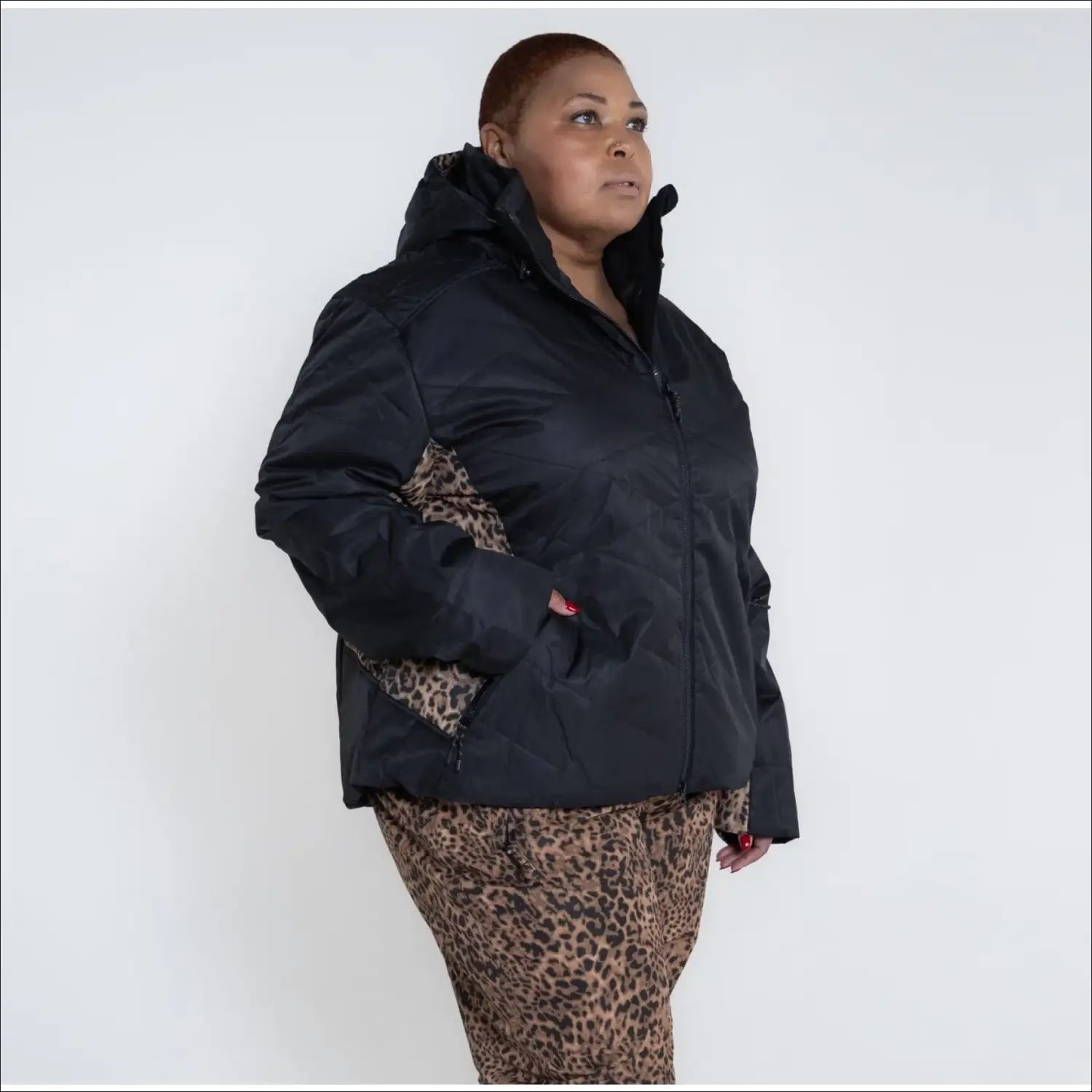Plus size women’s winter snow ski jacket featuring a black puffer design with leopard print accents