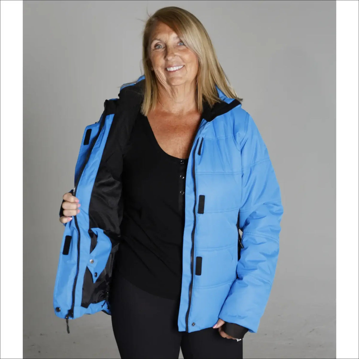 Blue puffer jacket with black lining from Snow Country Outerwear Women’s Aspen Ski Coat