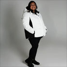 Woman wearing Snow Country Outerwear Womens Aspen Ski Jacket Coat in white and black