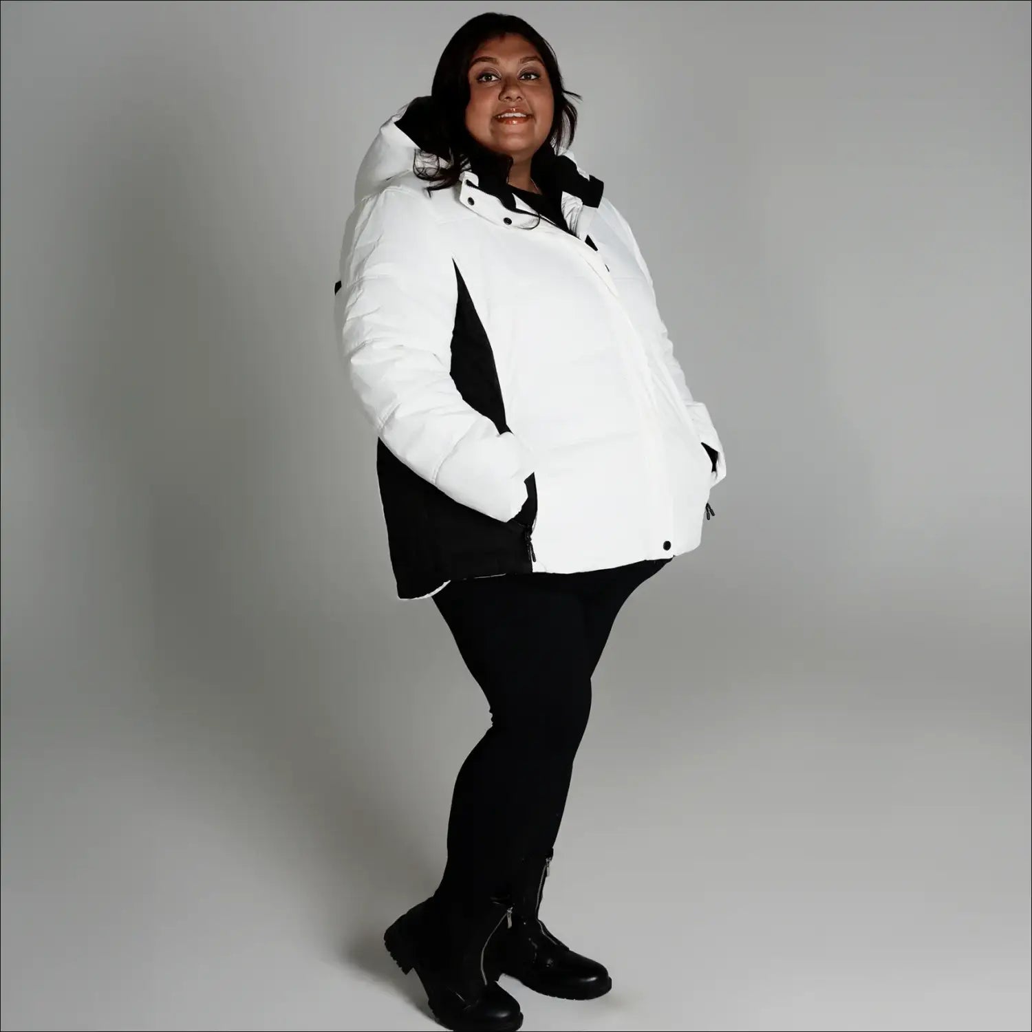Woman wearing Snow Country Outerwear Womens Aspen Ski Jacket Coat in white and black