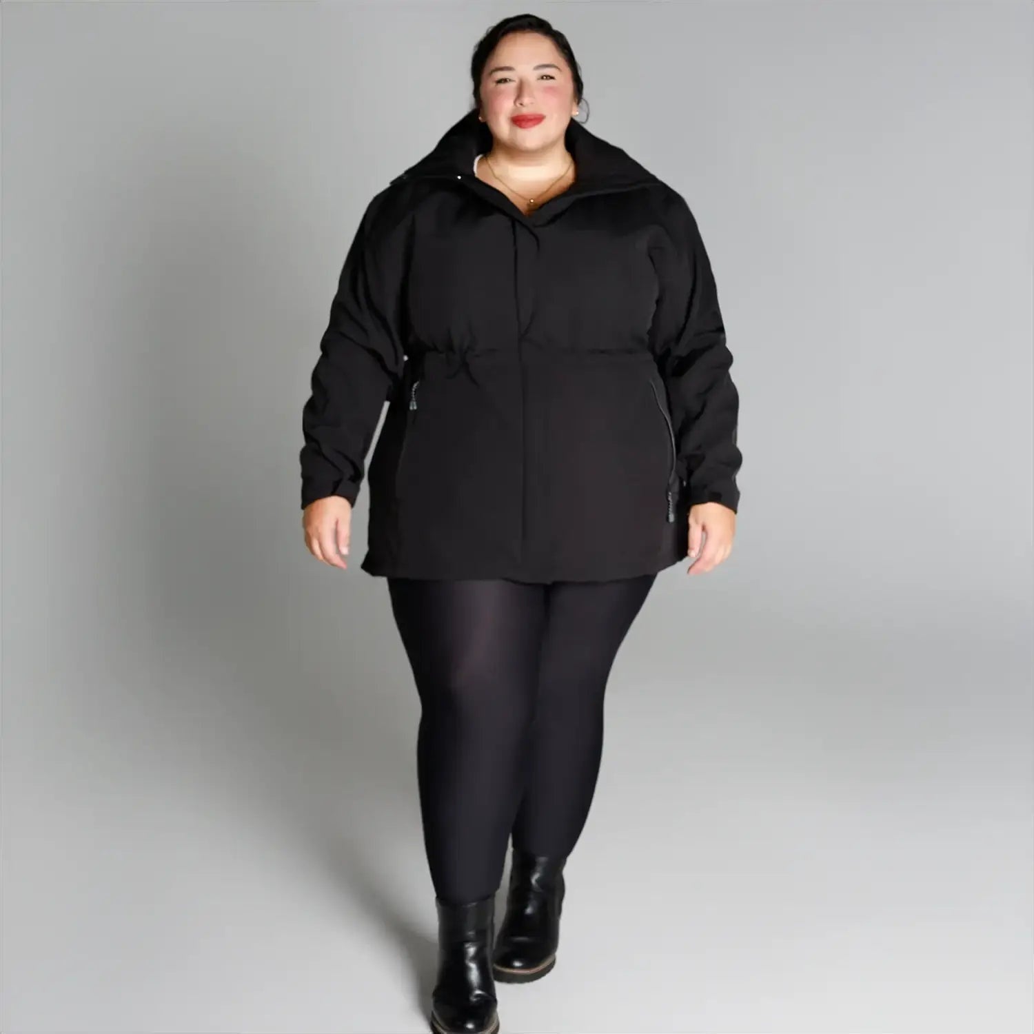 Plus size women wearing black jacket and leggings outfit featuring Stowe Mid Length Soft Shell Jacket