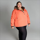 Coral-colored winter jacket with faux fur trim from Women’s Plus Size Alta Soft Shell Coat