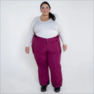 Woman wearing magenta Snow Country insulated ski pants for women in plus sizes
