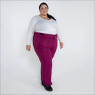 Woman wearing magenta Snow Country Outerwear insulated ski pants for plus size women