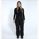 Woman wearing black ski pants and turtleneck from Snow Country Outerwear Ski Collection