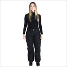 Woman in black turtleneck and snow pants wearing Snow Country Women’s Ski Pants