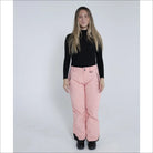 Woman in pink snow pants and black turtleneck wearing Snow Country Ski Pants