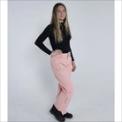 Woman in black top and pink ski pants wearing Snow Country Outerwear Women’s Ski Pants