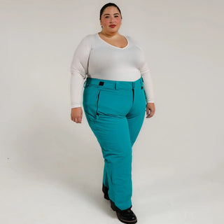 Woman wearing teal insulated ski pants from Snow Country Outerwear for women