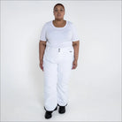 Woman wearing white insulated ski pants in Snow Country Outerwear Plus Size collection