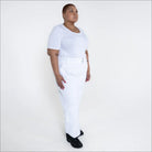 Woman in white outfit wearing Snow Country Plus Size Insulated Ski Pants