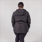 Black belted hooded jacket from Snow Country Outerwear Women’s Rain Jacket collection