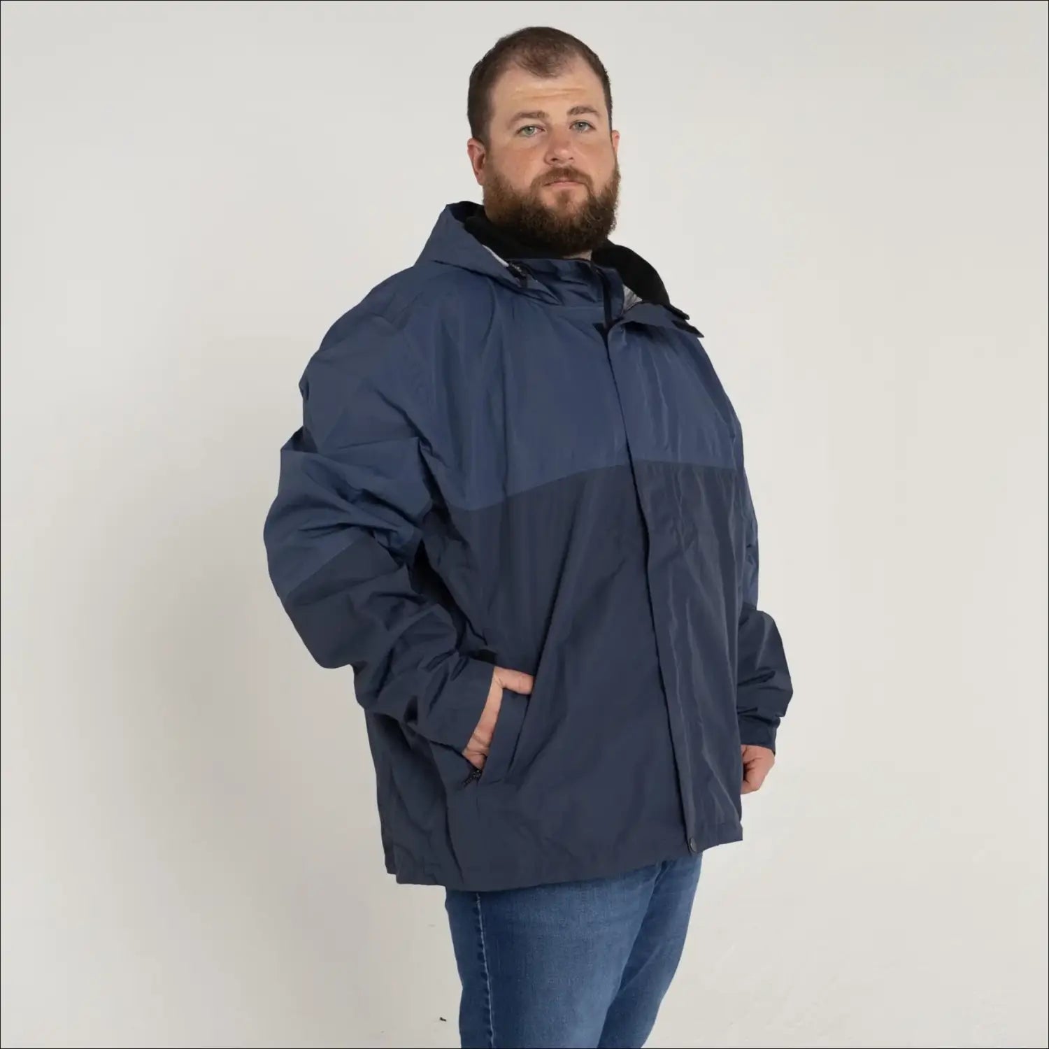 Man in blue rain jacket wearing Men’s Big 3XL-7XL Windbreaker Coat for Spring Fall Snow