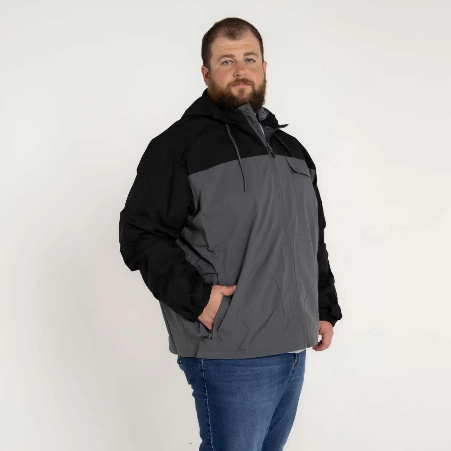 Man wearing Snow Country Outerwear 3X-7X Men’s Big Rain Jacket Windbreaker Packable