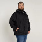 Man wearing black Snow Country Outerwear packable hooded rain jacket in big sizes