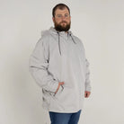Man wearing a gray hooded anorak from Men’s Big 3XL-7XL Rain Jacket Windguard Coat
